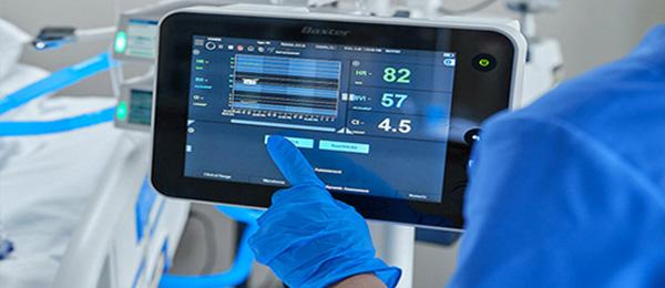 doctor touching buttons on machine