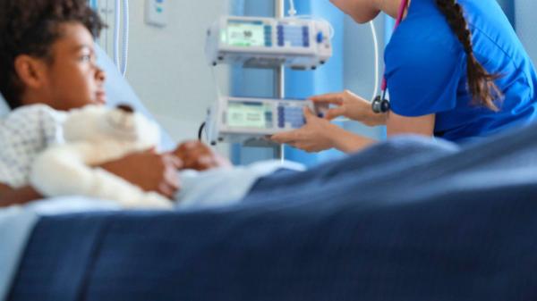 a nurse tends to a pediatric patient